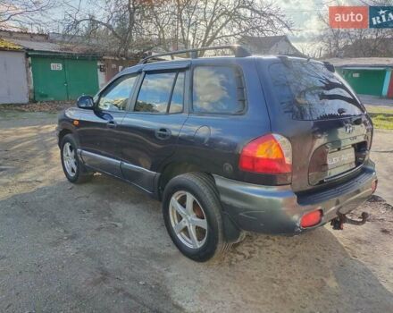 Синий Хендай Санта Фе, объемом двигателя 2.4 л и пробегом 293 тыс. км за 3500 $, фото 6 на Automoto.ua
