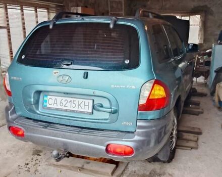 Зеленый Хендай Санта Фе, объемом двигателя 2 л и пробегом 300 тыс. км за 4200 $, фото 1 на Automoto.ua