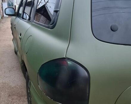 Зеленый Хендай Санта Фе, объемом двигателя 2 л и пробегом 284 тыс. км за 2900 $, фото 3 на Automoto.ua