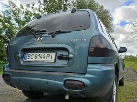 Зеленый Хендай Санта Фе, объемом двигателя 2 л и пробегом 350 тыс. км за 3349 $, фото 1 на Automoto.ua