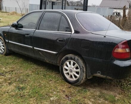 Черный Хендай Соната, объемом двигателя 2 л и пробегом 300 тыс. км за 1200 $, фото 1 на Automoto.ua