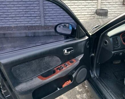 Черный Хендай Соната, объемом двигателя 2 л и пробегом 345 тыс. км за 2900 $, фото 24 на Automoto.ua