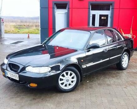 Черный Хендай Соната, объемом двигателя 2 л и пробегом 200 тыс. км за 1350 $, фото 1 на Automoto.ua