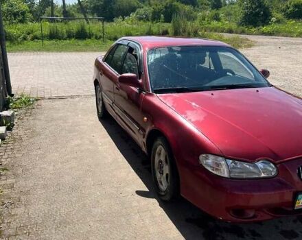 Красный Хендай Соната, объемом двигателя 2 л и пробегом 230 тыс. км за 1600 $, фото 6 на Automoto.ua