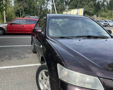 Красный Хендай Соната, объемом двигателя 2.36 л и пробегом 344 тыс. км за 5650 $, фото 6 на Automoto.ua