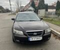 Красный Хендай Соната, объемом двигателя 2.4 л и пробегом 252 тыс. км за 5800 $, фото 1 на Automoto.ua