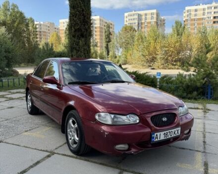 Красный Хендай Соната, объемом двигателя 2 л и пробегом 200 тыс. км за 1900 $, фото 1 на Automoto.ua
