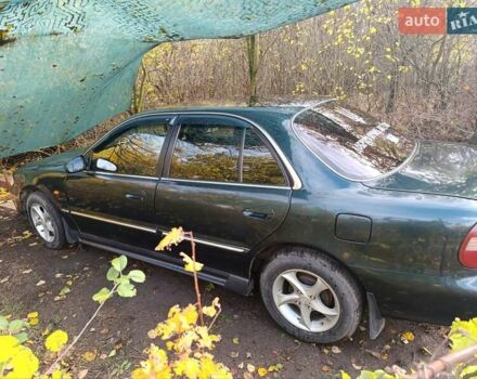 Зеленый Хендай Соната, объемом двигателя 2 л и пробегом 312 тыс. км за 1800 $, фото 3 на Automoto.ua