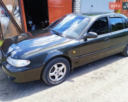 Зеленый Хендай Соната, объемом двигателя 2 л и пробегом 225 тыс. км за 2600 $, фото 1 на Automoto.ua