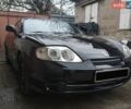 Черный Хендай Тибурон, объемом двигателя 2 л и пробегом 193 тыс. км за 5300 $, фото 1 на Automoto.ua