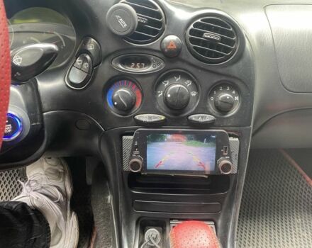 Красный Хендай Тибурон, объемом двигателя 2 л и пробегом 98 тыс. км за 3622 $, фото 2 на Automoto.ua