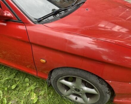 Красный Хендай Тибурон, объемом двигателя 2 л и пробегом 98 тыс. км за 3622 $, фото 1 на Automoto.ua