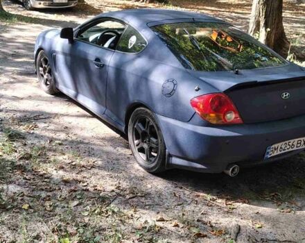 Синий Хендай Тибурон, объемом двигателя 2 л и пробегом 178 тыс. км за 2800 $, фото 3 на Automoto.ua