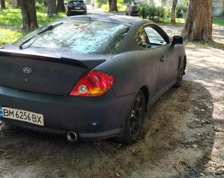 Синий Хендай Тибурон, объемом двигателя 2 л и пробегом 178 тыс. км за 2800 $, фото 2 на Automoto.ua