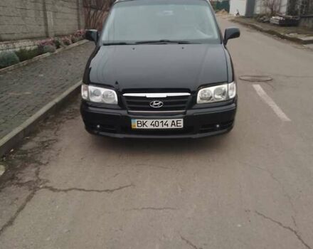 Черный Хендай Траджет, объемом двигателя 1.99 л и пробегом 235 тыс. км за 3999 $, фото 4 на Automoto.ua