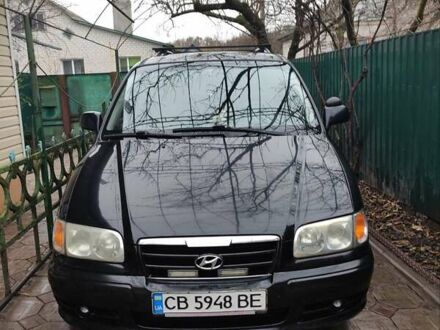 Черный Хендай Траджет, объемом двигателя 2 л и пробегом 297 тыс. км за 4500 $, фото 1 на Automoto.ua