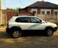 Білий Хендай Туксон, об'ємом двигуна 2 л та пробігом 136 тис. км за 11000 $, фото 1 на Automoto.ua