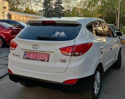 Білий Хендай Туксон, об'ємом двигуна 2 л та пробігом 96 тис. км за 13500 $, фото 7 на Automoto.ua