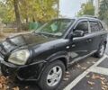 Черный Хендай Туксон, объемом двигателя 2 л и пробегом 250 тыс. км за 4450 $, фото 1 на Automoto.ua