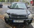 Черный Хендай Туксон, объемом двигателя 2 л и пробегом 250 тыс. км за 4450 $, фото 1 на Automoto.ua