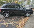 Черный Хендай Туксон, объемом двигателя 2 л и пробегом 250 тыс. км за 4450 $, фото 2 на Automoto.ua
