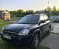 Черный Хендай Туксон, объемом двигателя 2 л и пробегом 200 тыс. км за 4200 $, фото 4 на Automoto.ua