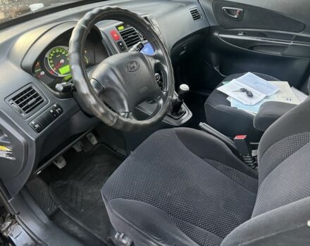 Черный Хендай Туксон, объемом двигателя 2 л и пробегом 276 тыс. км за 6950 $, фото 6 на Automoto.ua