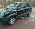 Черный Хендай Туксон, объемом двигателя 2 л и пробегом 320 тыс. км за 7000 $, фото 1 на Automoto.ua