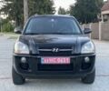 Черный Хендай Туксон, объемом двигателя 2 л и пробегом 250 тыс. км за 7950 $, фото 1 на Automoto.ua