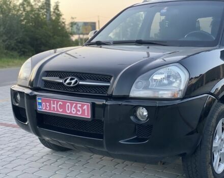 Черный Хендай Туксон, объемом двигателя 2 л и пробегом 250 тыс. км за 7950 $, фото 4 на Automoto.ua