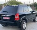 Черный Хендай Туксон, объемом двигателя 2 л и пробегом 250 тыс. км за 7950 $, фото 5 на Automoto.ua