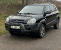 Черный Хендай Туксон, объемом двигателя 2 л и пробегом 220 тыс. км за 7000 $, фото 1 на Automoto.ua
