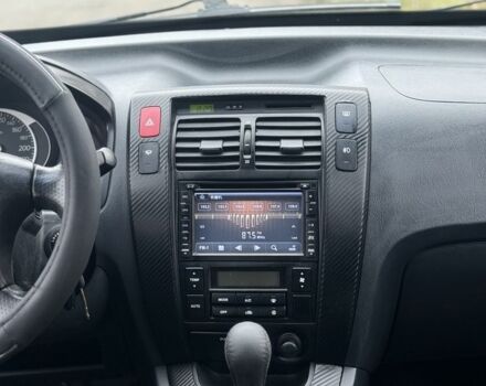 Черный Хендай Туксон, объемом двигателя 2 л и пробегом 220 тыс. км за 7000 $, фото 7 на Automoto.ua