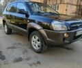 Черный Хендай Туксон, объемом двигателя 2 л и пробегом 256 тыс. км за 8000 $, фото 1 на Automoto.ua