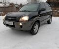 Черный Хендай Туксон, объемом двигателя 2 л и пробегом 256 тыс. км за 7500 $, фото 1 на Automoto.ua