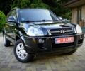Черный Хендай Туксон, объемом двигателя 2 л и пробегом 225 тыс. км за 8600 $, фото 1 на Automoto.ua