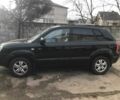 Черный Хендай Туксон, объемом двигателя 2 л и пробегом 200 тыс. км за 4200 $, фото 1 на Automoto.ua