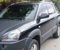 Чорний Хендай Туксон, об'ємом двигуна 2 л та пробігом 240 тис. км за 10541 $, фото 1 на Automoto.ua