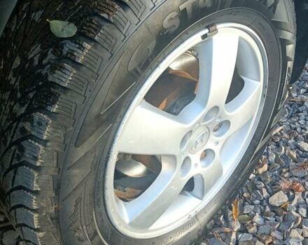 Черный Хендай Туксон, объемом двигателя 2 л и пробегом 236 тыс. км за 6000 $, фото 21 на Automoto.ua