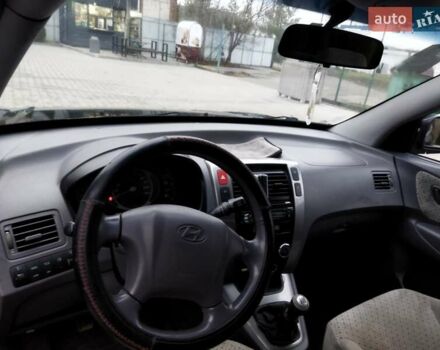 Черный Хендай Туксон, объемом двигателя 1.99 л и пробегом 204 тыс. км за 6100 $, фото 42 на Automoto.ua