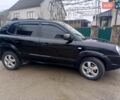 Черный Хендай Туксон, объемом двигателя 1.99 л и пробегом 302 тыс. км за 6300 $, фото 1 на Automoto.ua