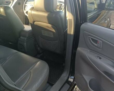 Черный Хендай Туксон, объемом двигателя 2 л и пробегом 236 тыс. км за 6000 $, фото 14 на Automoto.ua