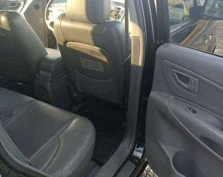 Черный Хендай Туксон, объемом двигателя 2 л и пробегом 236 тыс. км за 6000 $, фото 13 на Automoto.ua