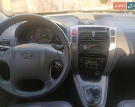 Черный Хендай Туксон, объемом двигателя 1.99 л и пробегом 302 тыс. км за 6300 $, фото 9 на Automoto.ua