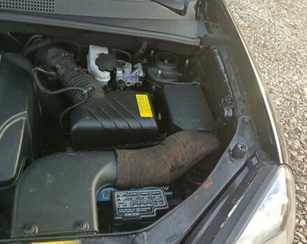 Черный Хендай Туксон, объемом двигателя 2 л и пробегом 236 тыс. км за 6000 $, фото 22 на Automoto.ua