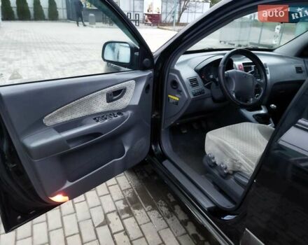 Черный Хендай Туксон, объемом двигателя 1.99 л и пробегом 204 тыс. км за 6100 $, фото 35 на Automoto.ua