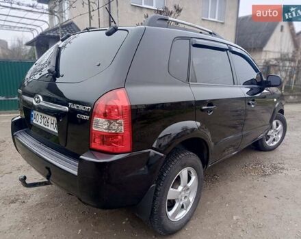 Черный Хендай Туксон, объемом двигателя 1.99 л и пробегом 302 тыс. км за 6300 $, фото 15 на Automoto.ua