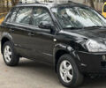 Черный Хендай Туксон, объемом двигателя 2 л и пробегом 280 тыс. км за 3250 $, фото 1 на Automoto.ua