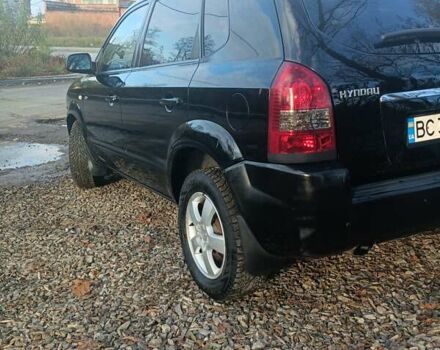 Черный Хендай Туксон, объемом двигателя 2 л и пробегом 236 тыс. км за 6000 $, фото 1 на Automoto.ua