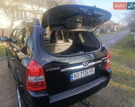Черный Хендай Туксон, объемом двигателя 1.99 л и пробегом 302 тыс. км за 6300 $, фото 10 на Automoto.ua